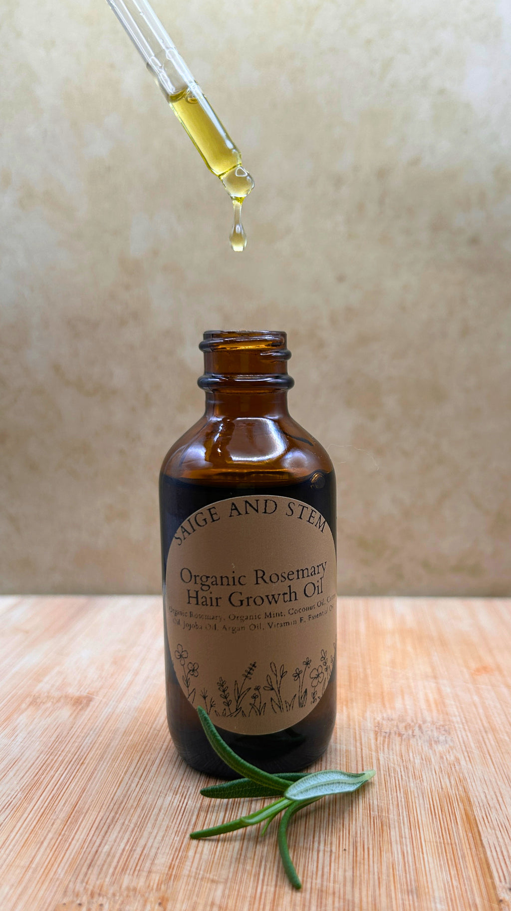 Rosemary Hair Growth Set featuring organic rosemary oil in a brown glass bottle with a dropper and fresh rosemary sprig.