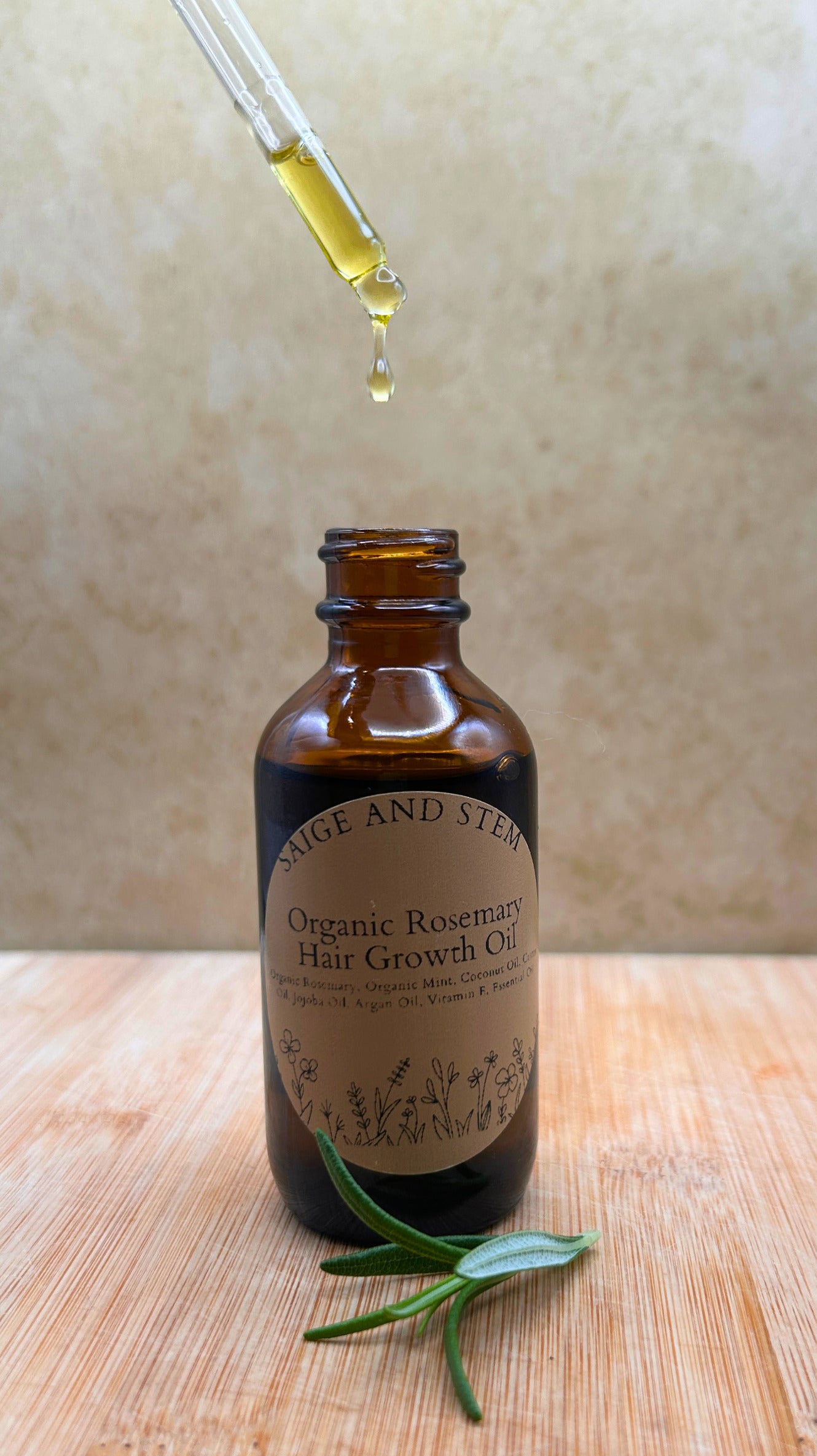 Rosemary Hair Growth Set featuring organic rosemary oil in a brown glass bottle with a dropper and fresh rosemary sprig.